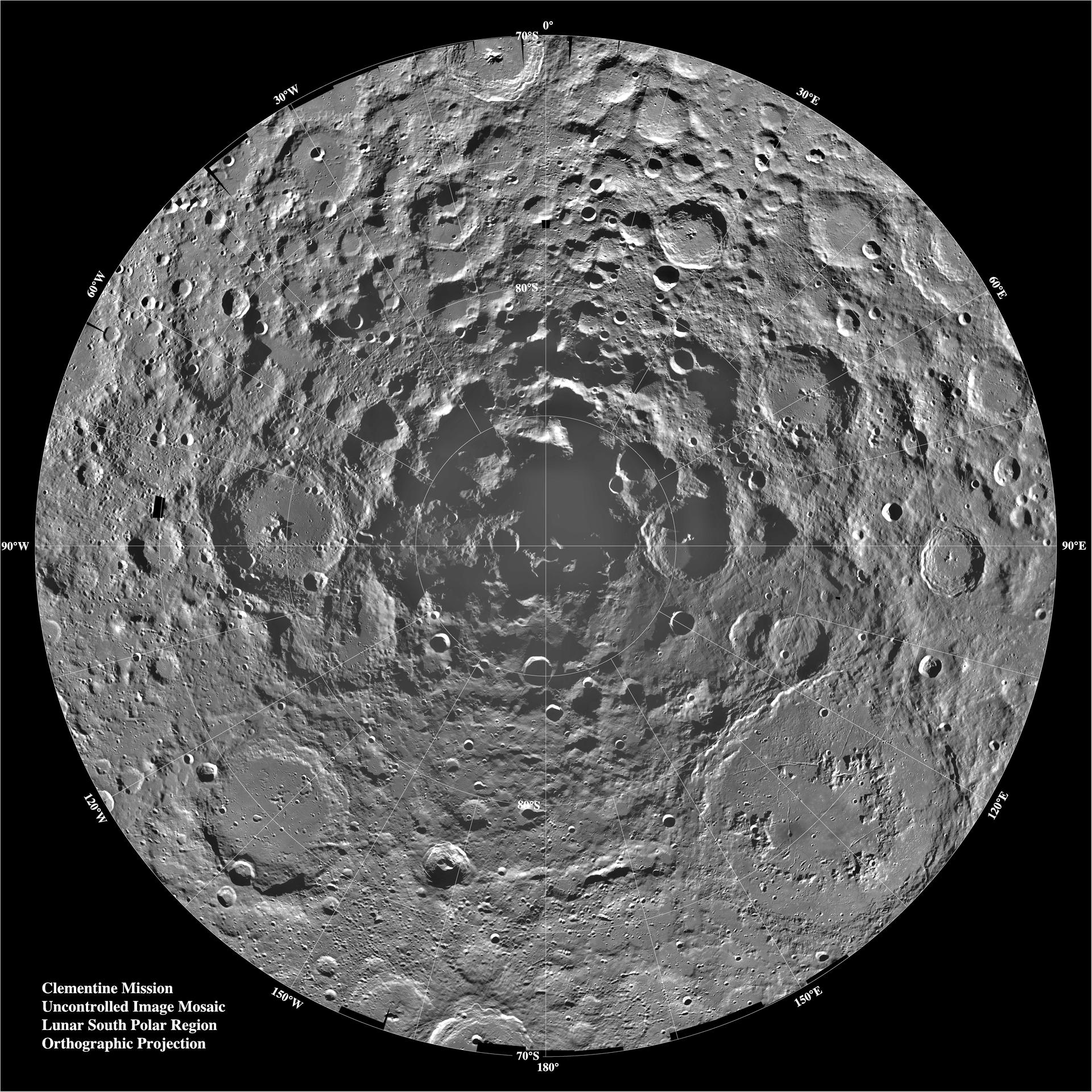 View of the lunar South Pole. In the center of the image, the Moon's slate grey surface is visible. Dotted with craters the visual is one that is uncommon and from a unique angle. The background of the image is a dark black of space. Radial guidelines permeate from the center of the Moon showing directional degrees from the South Pole. The bottom left of the image states "Clementine Mission. Uncontrolled Image Mosaic. Lunar South Polar Region. Orthographic Projection."