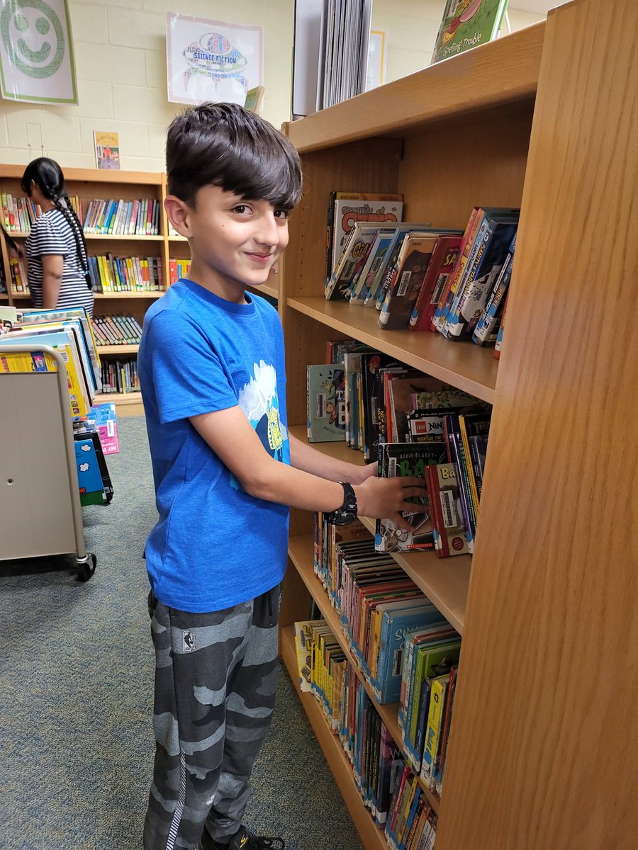 One of our wonderful Walzem readers ready to check out a good book! #walzemrocks #neisdlibs