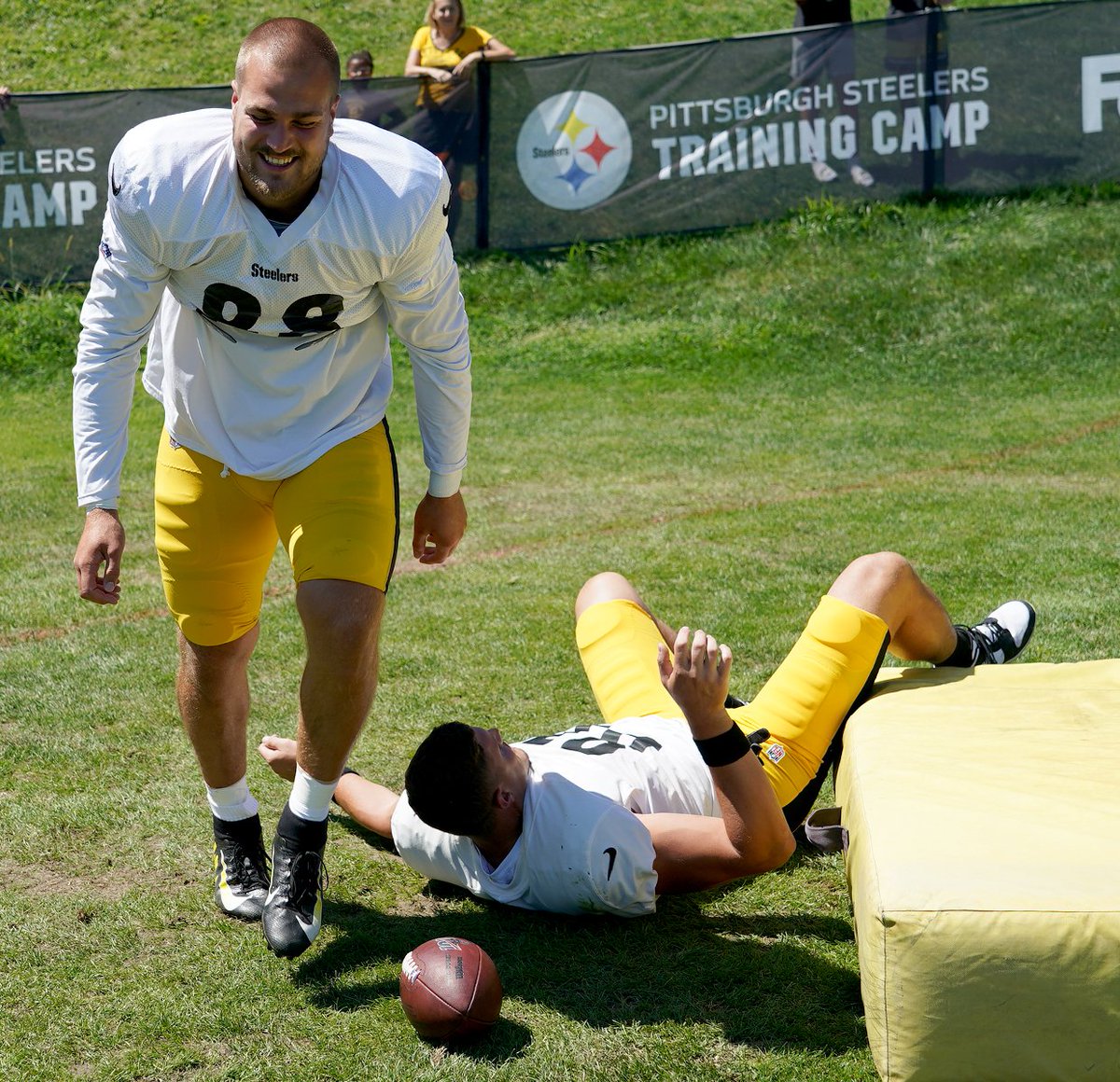Steelers tight end Zach Gentry slides off the practice mat - then gets fake CPR and almost mouth-to-mouth from fellow tight end Pat Freiermuth during training camp Thursday in Latrobe.