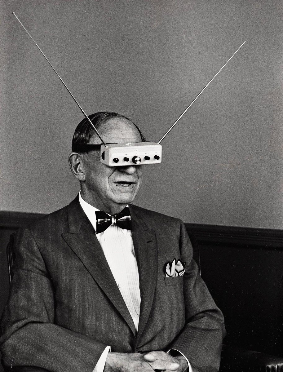 HistoryInPics's tweet photo. This is science fiction pioneer Hugo Gernsback demonstrating his TV goggles, 1963 https://t.co/HtIOzmu8c6