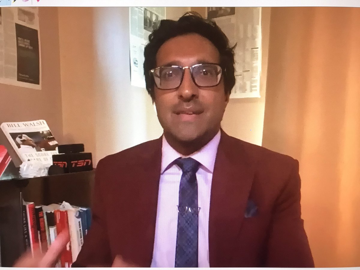 ConanDaly's tweet photo. So @TSN_Sports, let me get this straight; to be the Calgary bureau chief, I just have to commandeer a doctor’s office, slap some newspaper (!!!) up on a wall and lovingly place some logoed placards on a bookcase? Cool! https://t.co/byIB8D7R4R