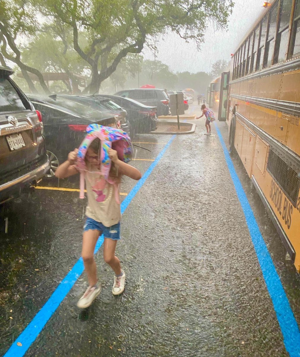 EanesSupt's tweet photo. Staff and students were cheerful despite a torrential downpour at dismissal. We need the rain so no one seemed to care @vvecardinals or @eemustangs . Thanks to Asst. Supt. Jeremy Trimble, who helped load buses in the deluge @eanesisd and probably ruined his new school shoes😓. https://t.co/ZFgdNJK8Ir