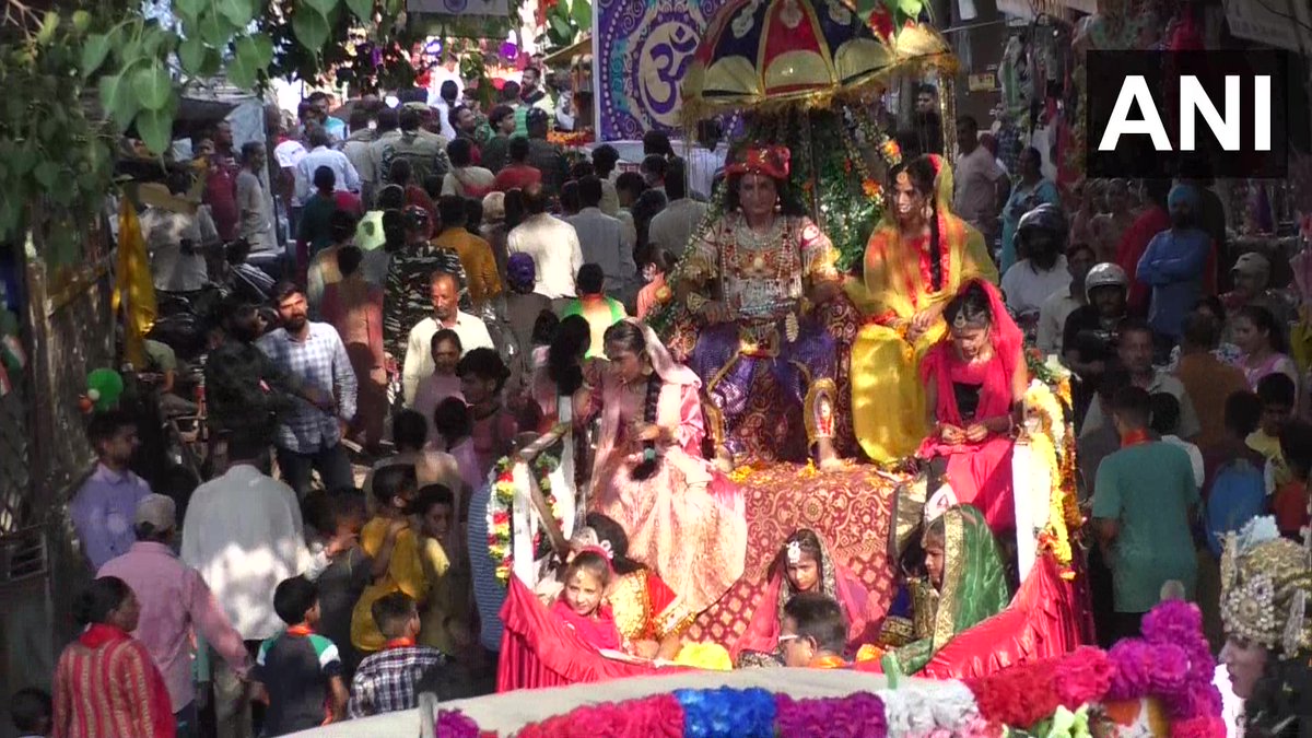 ANI's tweet photo. Jammu &amp; Kashmir | 'Shobha yatra’ was taken out in Udhampur on the occasion of Janmashtami. Thousands of people joined the yatra with kids dressed up as Lord Krishna and Radha. (18.08) https://t.co/6i6HbspUju