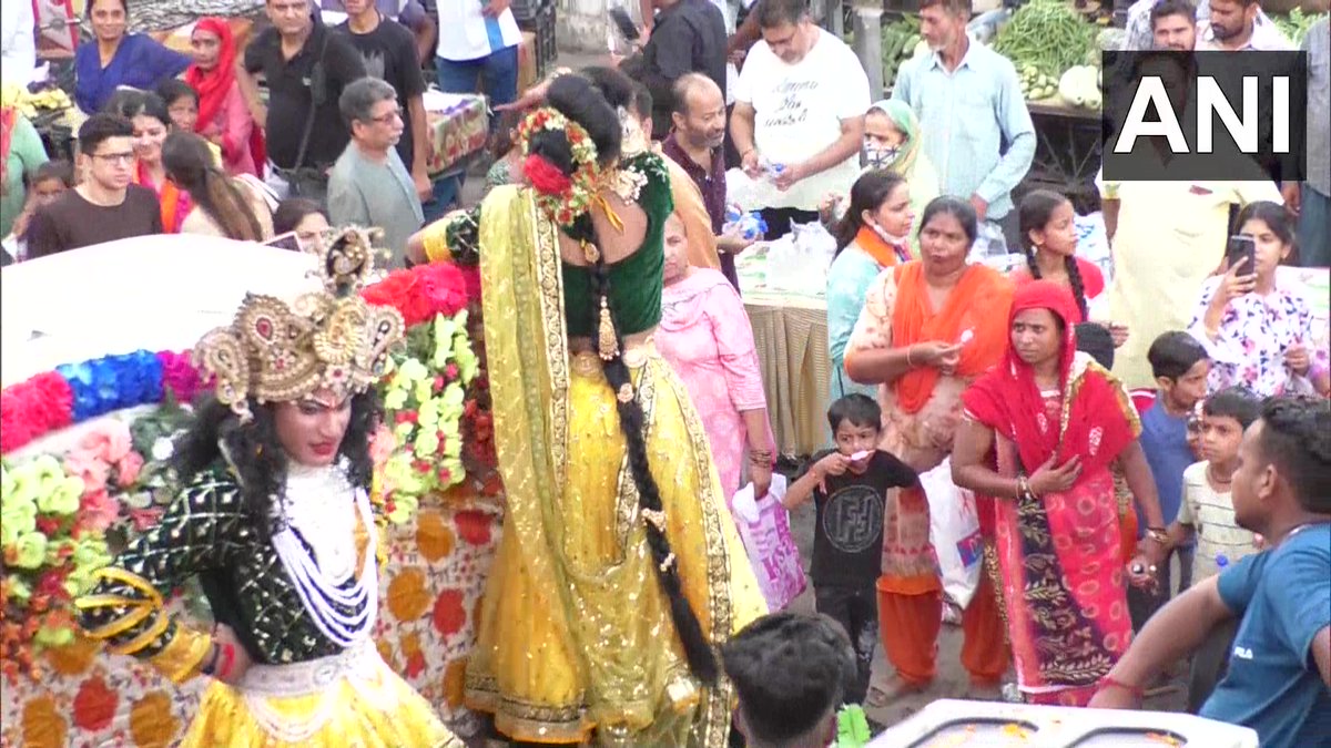 ANI's tweet photo. Jammu &amp; Kashmir | 'Shobha yatra’ was taken out in Udhampur on the occasion of Janmashtami. Thousands of people joined the yatra with kids dressed up as Lord Krishna and Radha. (18.08) https://t.co/6i6HbspUju