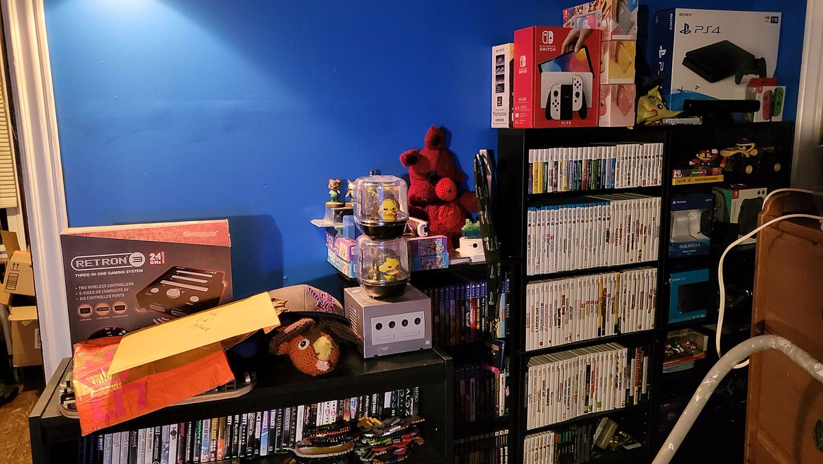 RealGSpider's tweet photo. Some good progress has been made in my room! It's all painted blue, I got my wall of games (that needs to be organized), my super cool gaming setup and a refined desk space. No longer is it messy! Best of all, it's liveable now so I've been here a bit. I'll update you more later. https://t.co/Nb1nfGVYTS