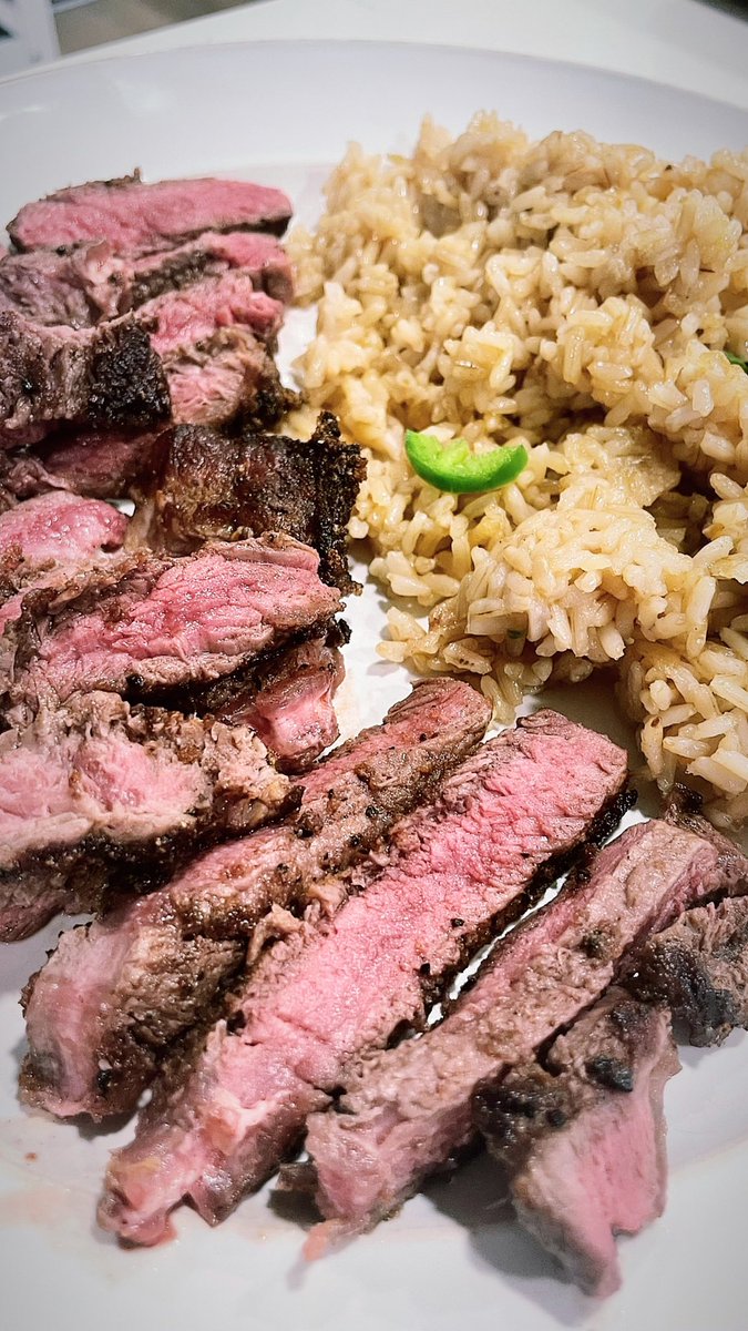eatsbyparker's tweet photo. seared bison ribeye seasoned with pork ribs crumbles and cowboy coffee rub. spicy garlic brown rice. https://t.co/7r0KufuKv8