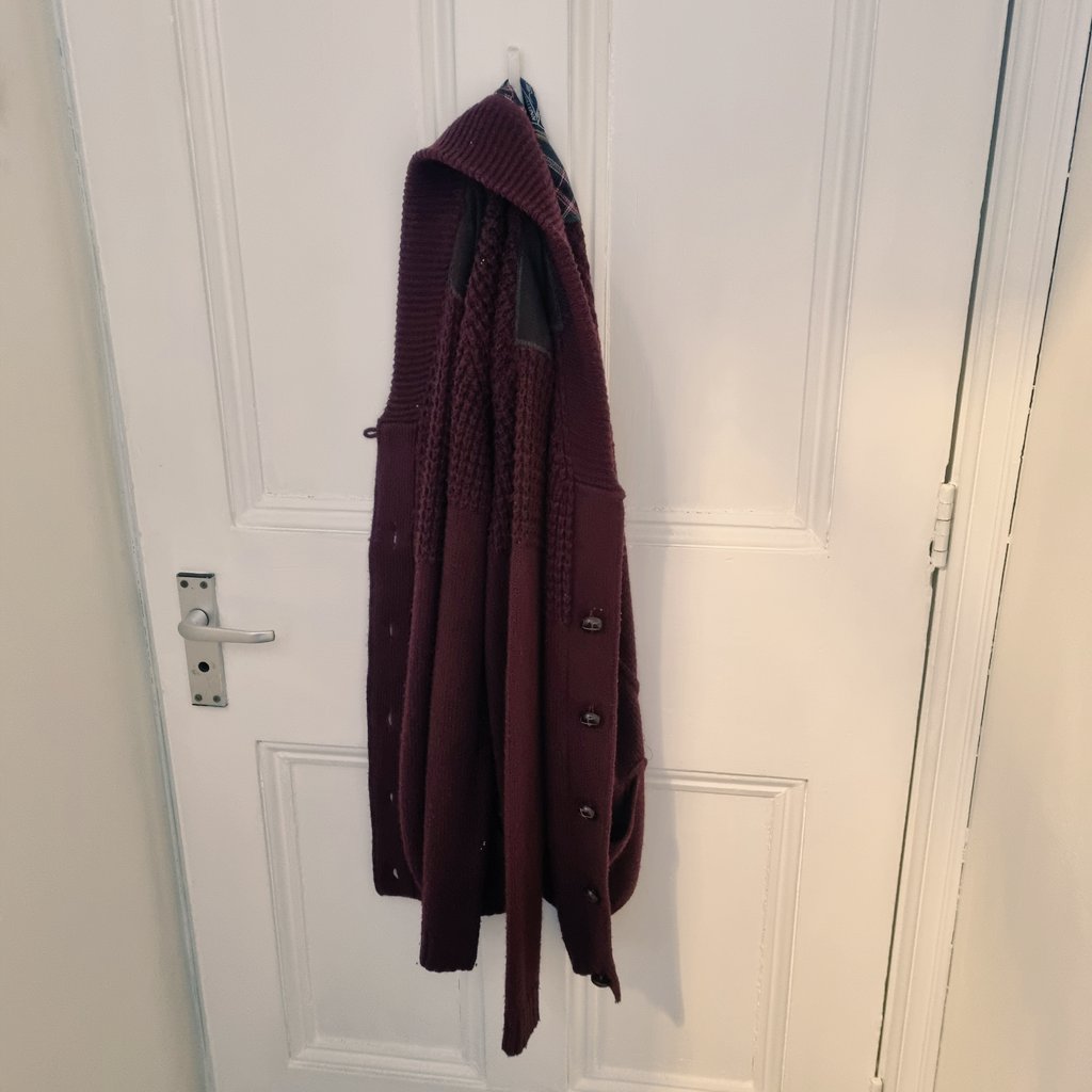 Behold, S̵o̵p̵h̵i̵e̵'̵s̵ ̵c̵a̵r̵d̵i̵g̵a̵n̵ the communal cardigan! This great garment hangs o̵n̵ ̵t̵h̵e̵ ̵b̵a̵c̵k̵ ̵o̵f̵ ̵t̵h̵e̵ ̵t̵o̵i̵l̵e̵t̵ ̵d̵o̵o̵r̵ in a prestigious place, and is adorned by any team member when they feel the office chill! (Albeit not recently) #funfactfriday