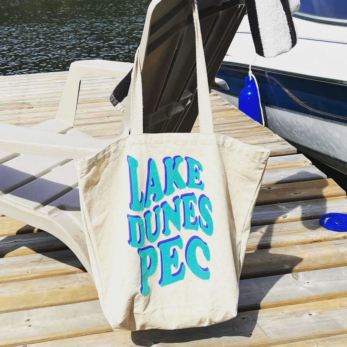 countytshirts's tweet photo. Lake Dunes PEC at the cottage! Who else is jumping in a Lake today?! 🌊🌊☀️☀️ Pick up one of these popular totes (also in PINK!) or your next favourite tee at our Picton store! We’re open until 6 Friday & Saturday! #pec #princeedwardcounty #visitpec #visitthecounty #countytshirts https://t.co/ZwdNHyrxG0