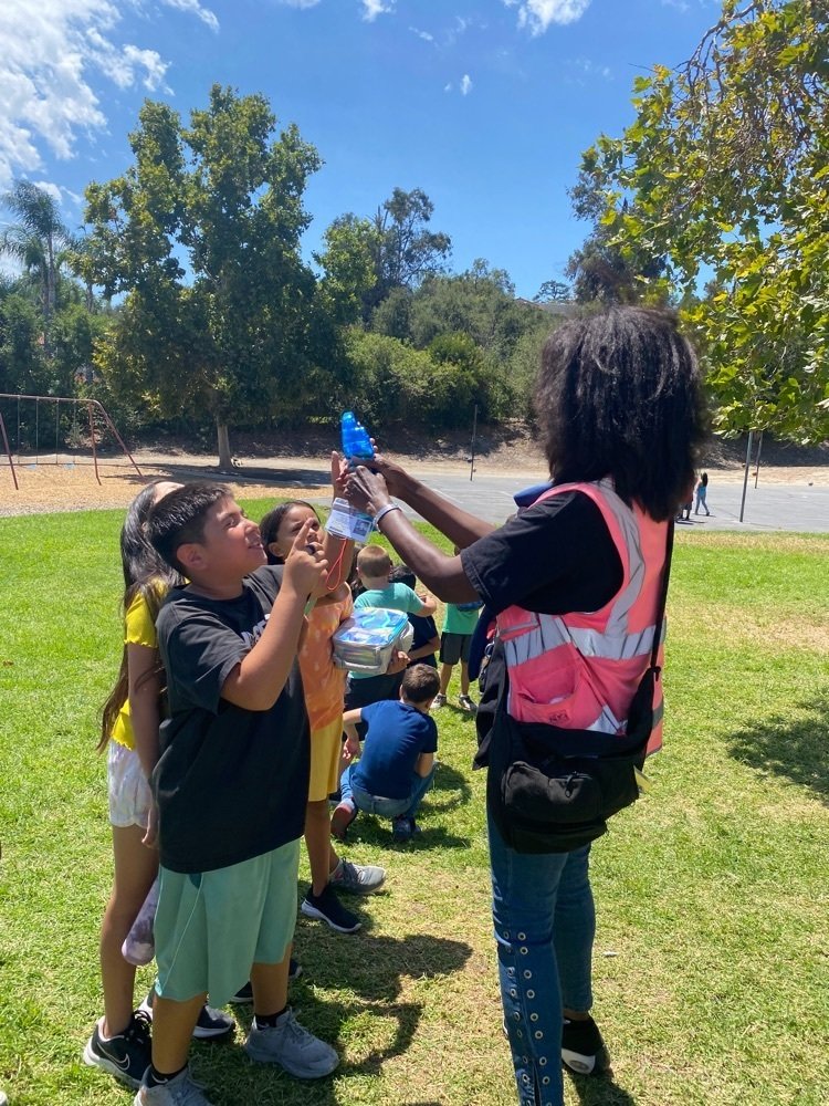 Ms. Sandy helping our students stay cool.