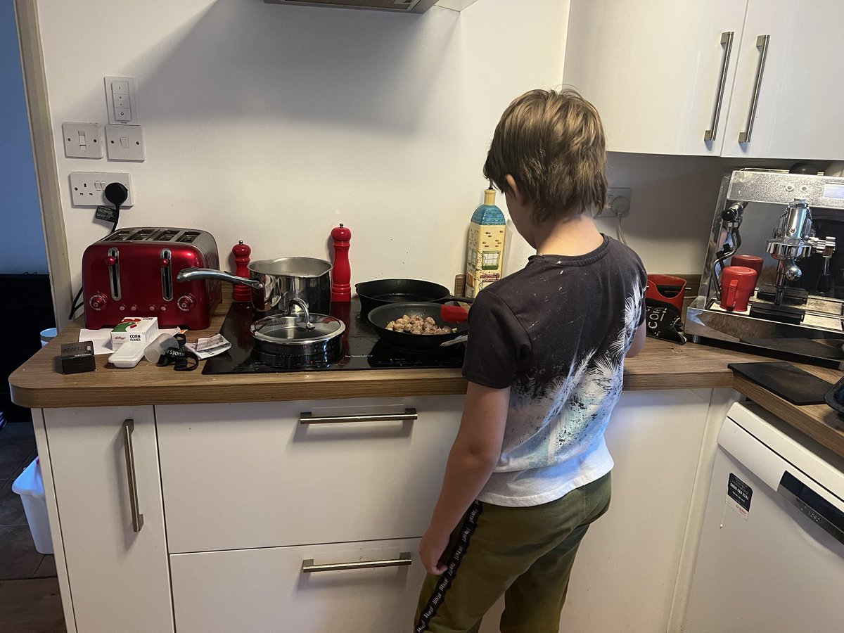 paulglavin's tweet photo. Cooking with the boy! Penne alla puttanesca (short on anchovies so we swapped in sausages because it ended in the same letters) apparently @MrNigelNg  will not approve https://t.co/yj6DV7ZMXj