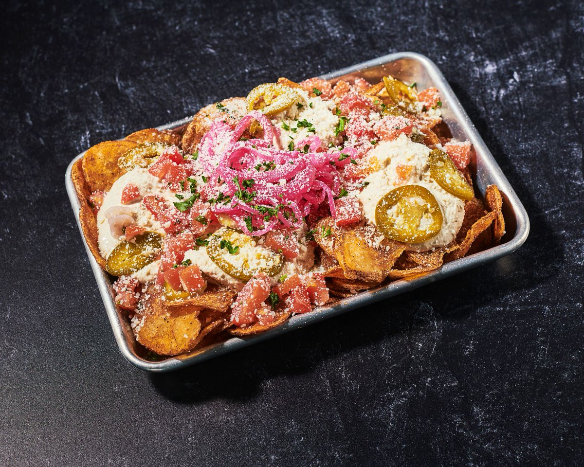 Our guests rave about our Pub Chips – housemade kettle chips with Guinness pub cheese, pickled jalapeño, tomato, and parmesan. They’re the perfect Friday treat, and hey, look what day it is!