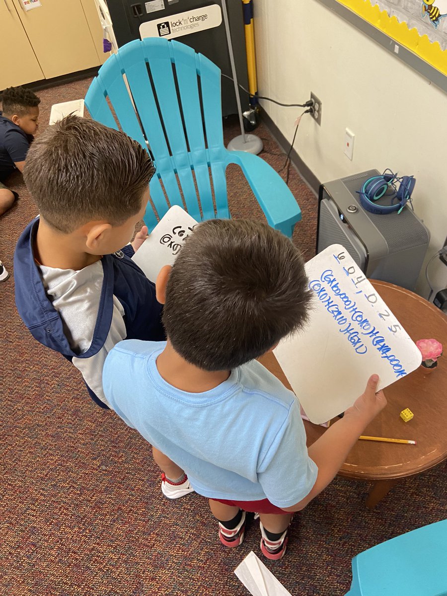 Students comparing work for Expanded notation <a href="/CharlesRDrewES/">Drew Elementary</a>