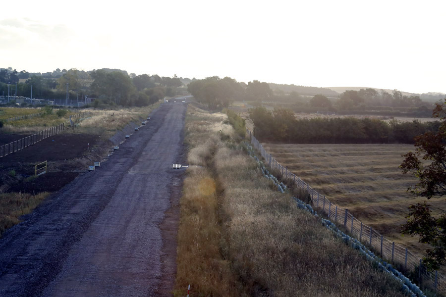 Marshrail's tweet photo. @eastwestrail Great to see @MarkMjames92 today at Bicester. Dawn saw me at the new Launton bridge OXD34A. Views east &amp; west with the former Launton level crossing now vanished under the embryonic trackbed. @bicesternews @VolkerRailUK engineers brilliant as ever. @RailwayMagazine https://t.co/LJW5wsowj5