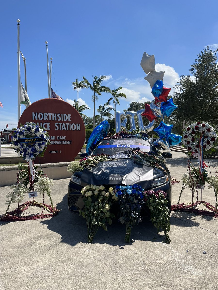 MBurgosNews's tweet photo. There is a growing memorial for @MiamiDadePD Officer Cesar Echaverry. Officers from different agencies are placing department badges on the car. @wsvn https://t.co/QigjspzU1u