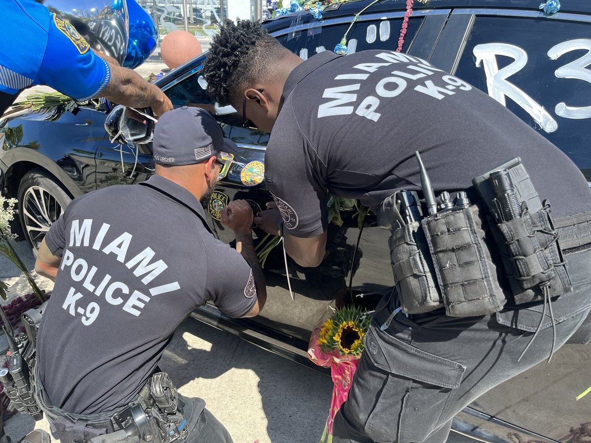 MBurgosNews's tweet photo. There is a growing memorial for @MiamiDadePD Officer Cesar Echaverry. Officers from different agencies are placing department badges on the car. @wsvn https://t.co/QigjspzU1u