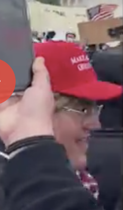 capitolresearc3's tweet photo. @creek_twit @OSINTyeti Also nice view of the #OrangeBackpackFlagGuy (temp tag) ca 6:43 who is a very enthusiastic waver - maybe no assignment but he is at minimum very happy to do big flag waves when he sees other people doing it. And #ButterfingerPB walks through at 9:22, in goggles. https://t.co/DGtJhpmhR0