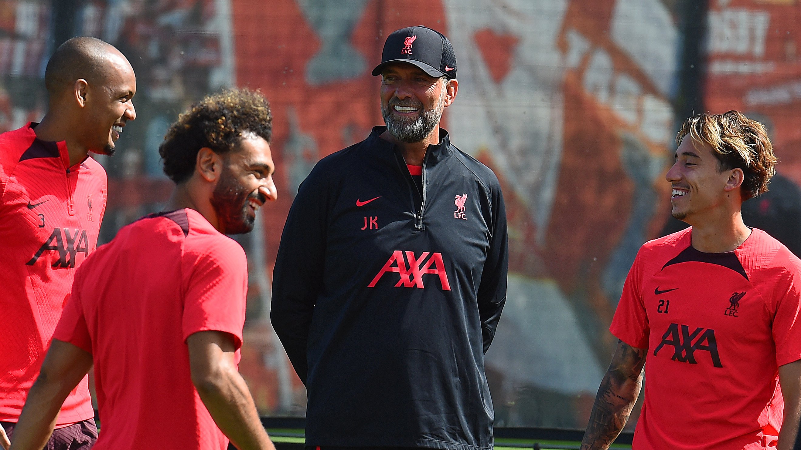 Fabinho, Mo Salah, Jürgen Klopp and Kostas Tsimikas smile during today's training session ahead of our Premier League fixture against Manchester United.