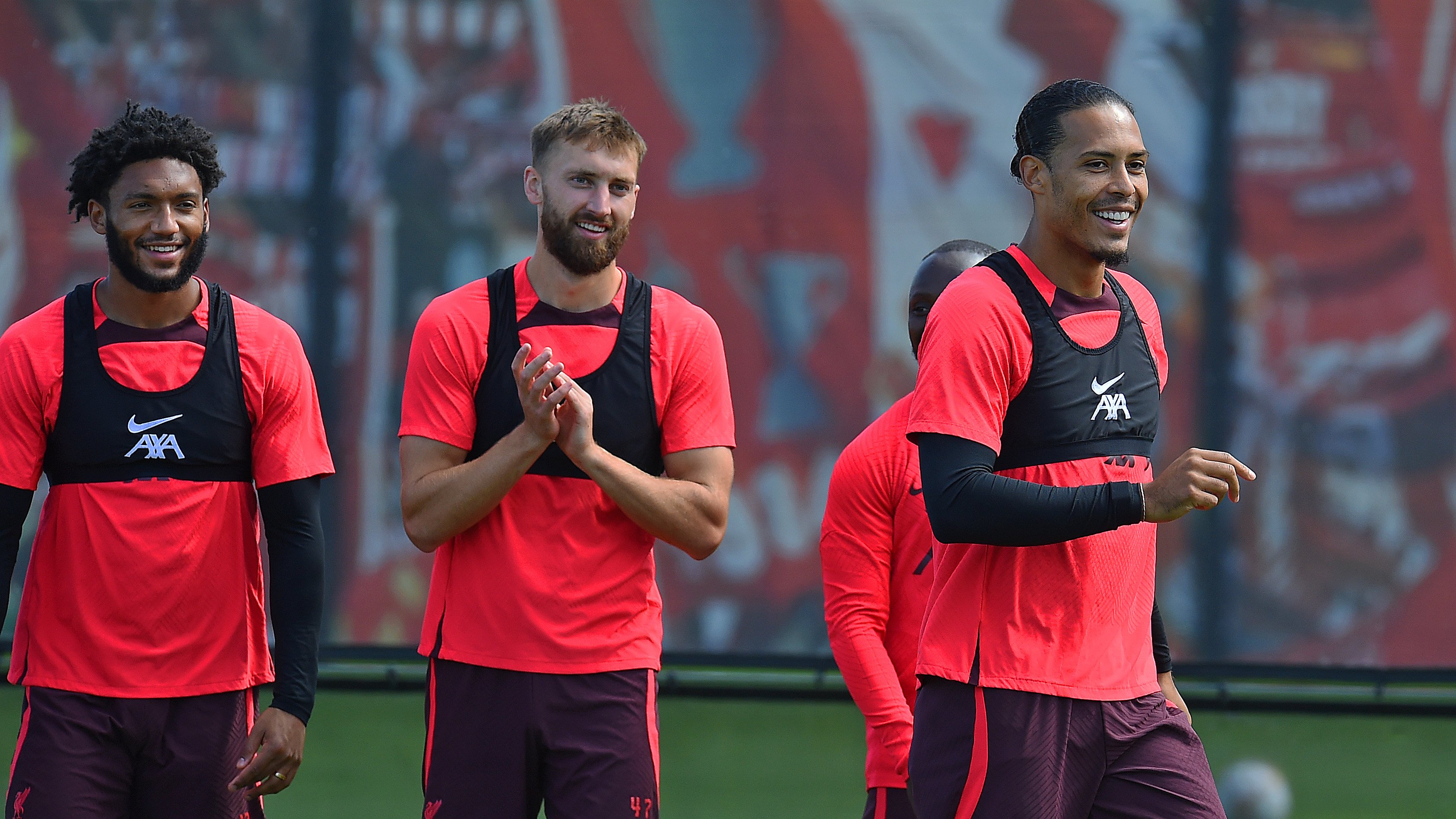 Joe Gomez, Nat Phillips and Virgil van Dijk smile during today's training session ahead of our Premier League fixture against Manchester United.