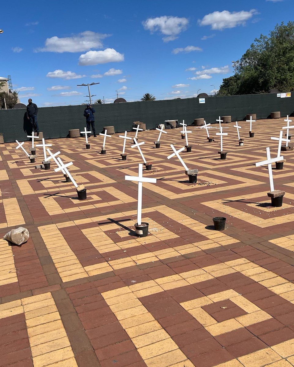 SocialistYM's tweet image. Yesterday, Wits SYM comrades put up an installation of 34 crosses to commemorate the 34 miners who were brutally gunned down during the Marikana Massacre.