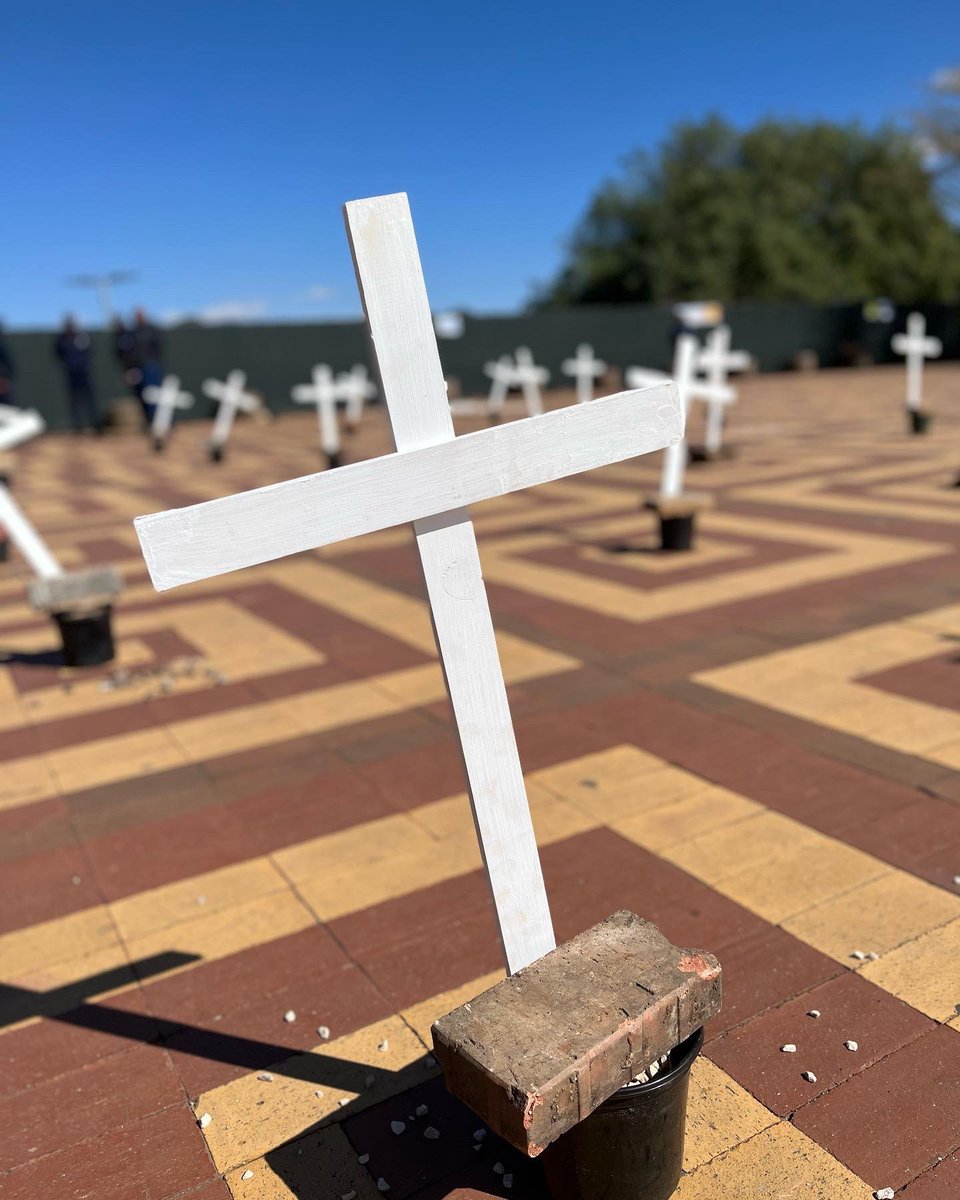 SocialistYM's tweet image. Yesterday, Wits SYM comrades put up an installation of 34 crosses to commemorate the 34 miners who were brutally gunned down during the Marikana Massacre.