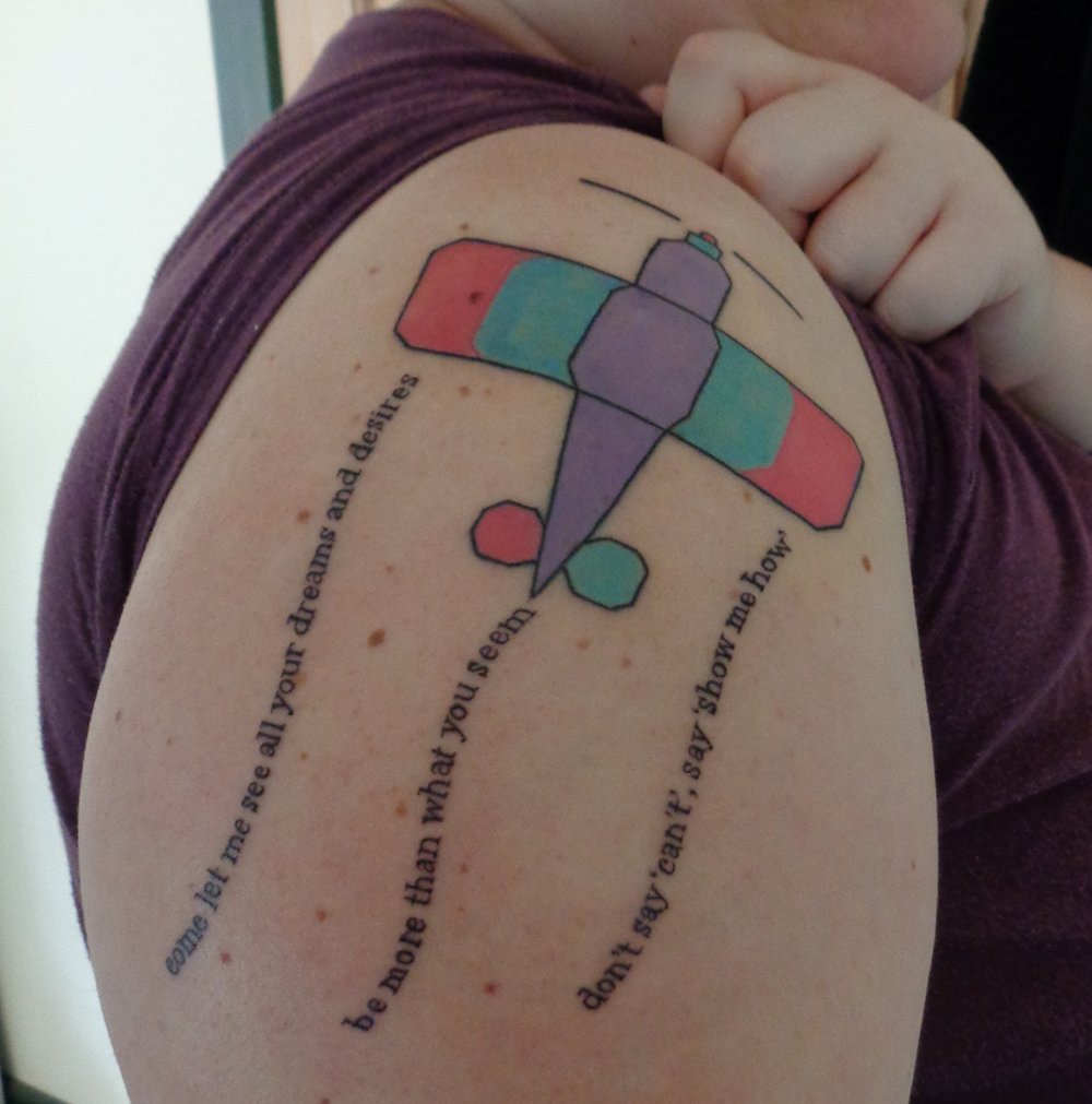 <a href="/seananmcguire/">Seanan McGuire</a> <a href="/vixyandtony/">Vixy and Tony</a> @taliskimberley This is a photo from when the tattoo was new. Now it looks like someone bolded the letters and added a slight blur filter. Maybe one day they'll just be smoke. But I'll know what they mean.