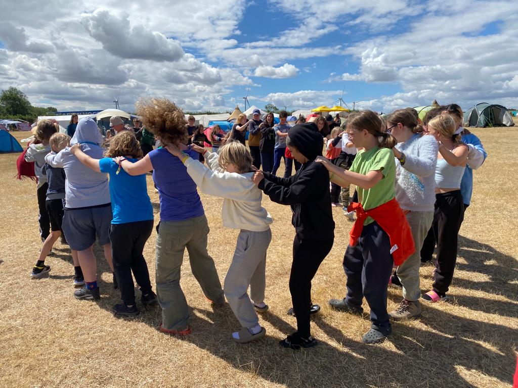 We had an amazing time <a href="/CGCamp2022/">Common Ground</a>. #Village13 had members from Eastbourne, Finland, L&amp;G, Mali and Watford. Here we are playing a game from Finland which involved smaller trains being gobbled up by bigger ones to become one giant snake!