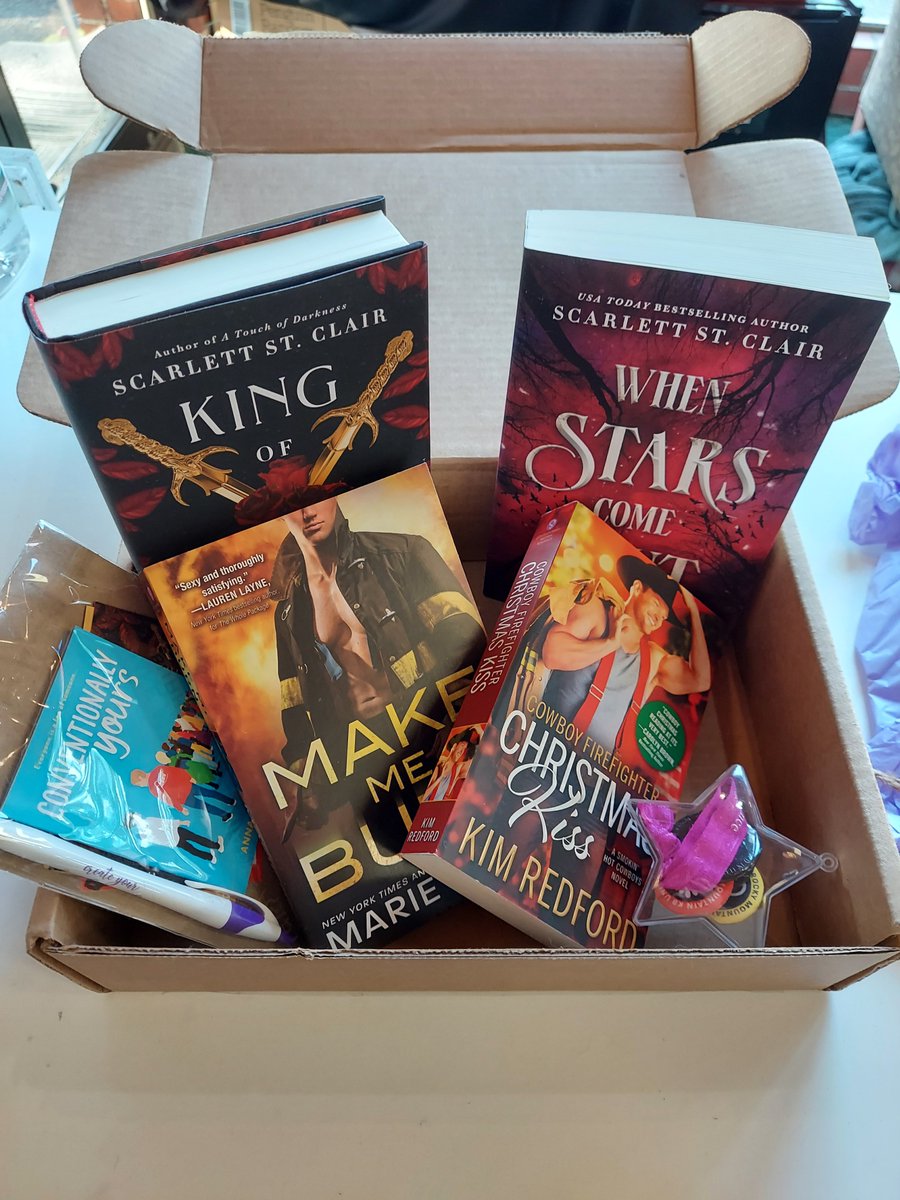 Basket no. 2 up for raffle is provided by <a href="/Sourcebooks/">Sourcebooks</a> who sent us this wonderful box full of romance goodies.