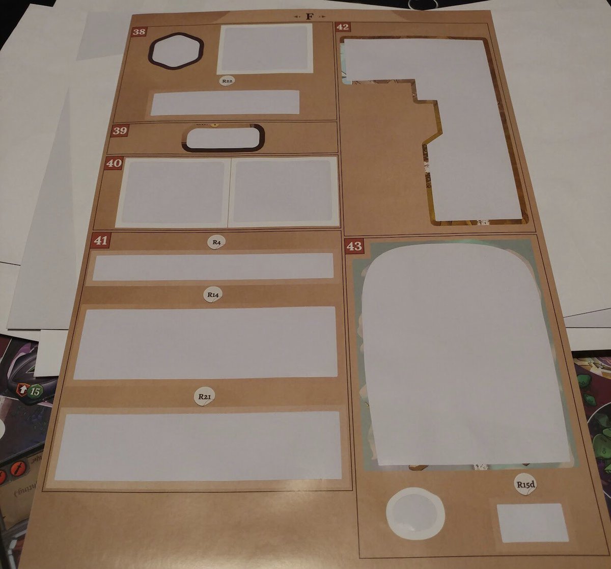 BoardGameBloke's tweet photo. We finished Clank! Legacy #boardgame last night. No spoilers. I obfuscated the pics. We had applied so many stickers sheets were empty.
Richard got a piece of paper at the end. The last few games had plenty of us lying down on the job.
#VCSBG https://t.co/N1bKDlvX3w