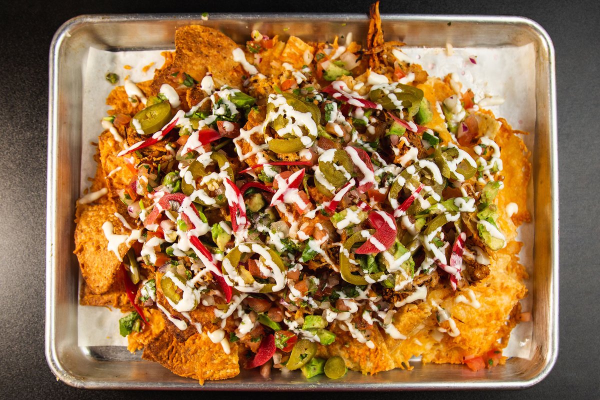 Nachos. Dan good beer DIPA pickled red onion &amp; jalapeno, cheddar jack, pico de gallo, avocado, cilantro miso aioli. Choice of Chicken ($18) Short Rib ($18) or Plain ($12)