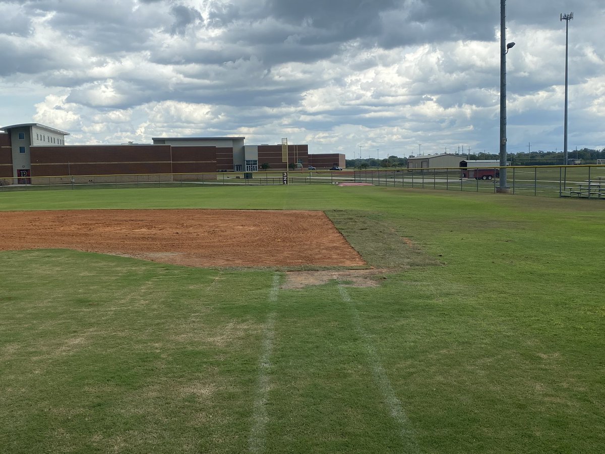 Parkway baseball players putting the work in on the field, preparing the field to lay down some new sod.