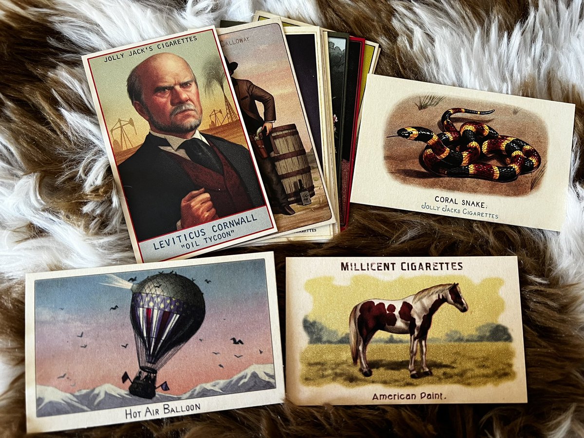 Challenge coin, cigarette cards, treasure map, and playing cards. So much  cool stuff in this box!
