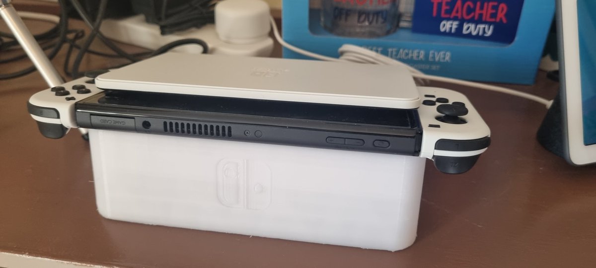 HamsterPrints's tweet photo. Printed a @NintendoEurope switch OLED Dock to make it easier to get in and out under a shelf, fits perfectly! Added feet to stop it sliding.  #3Dprinting #NintendoSwitchOLED https://t.co/xUYkkmJK1F