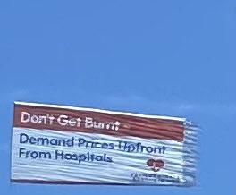 Strange way to get information about the US health are system. Flown over beach in ocean city Maryland.