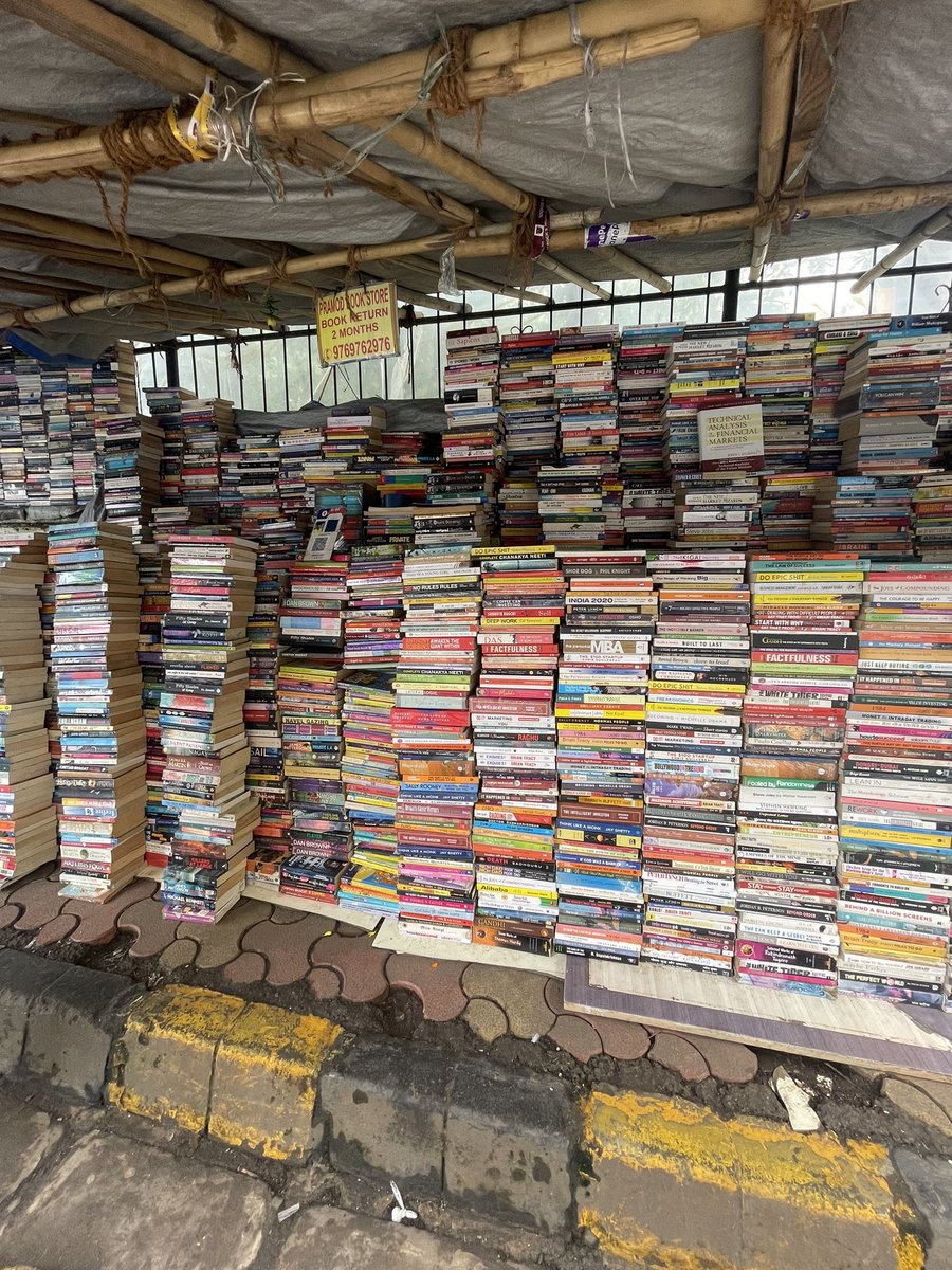 viraj_sheth's tweet photo. These roadside bookstores in India are truly a wonder in themselves.

The folks running these stores may not have the fanciest degrees or even an upbringing that would give them access to all these books, yet they remember each and every author and book title by name. https://t.co/RSLT14E2yU
