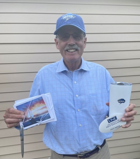 Jim Stone SFC '73 is rocking his new UNE merch from our social media survey giveaway. Looking good, Jim!
