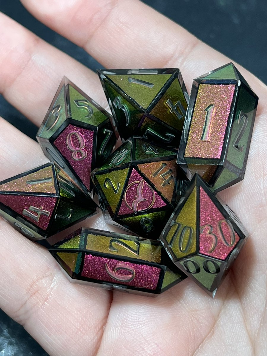 Nighthawk_Dice's tweet photo. I always have a soft spot for color shift dice, but adding the black frame really took these to another level. 😌 #dice #handmadedice https://t.co/YsywajkmRT
