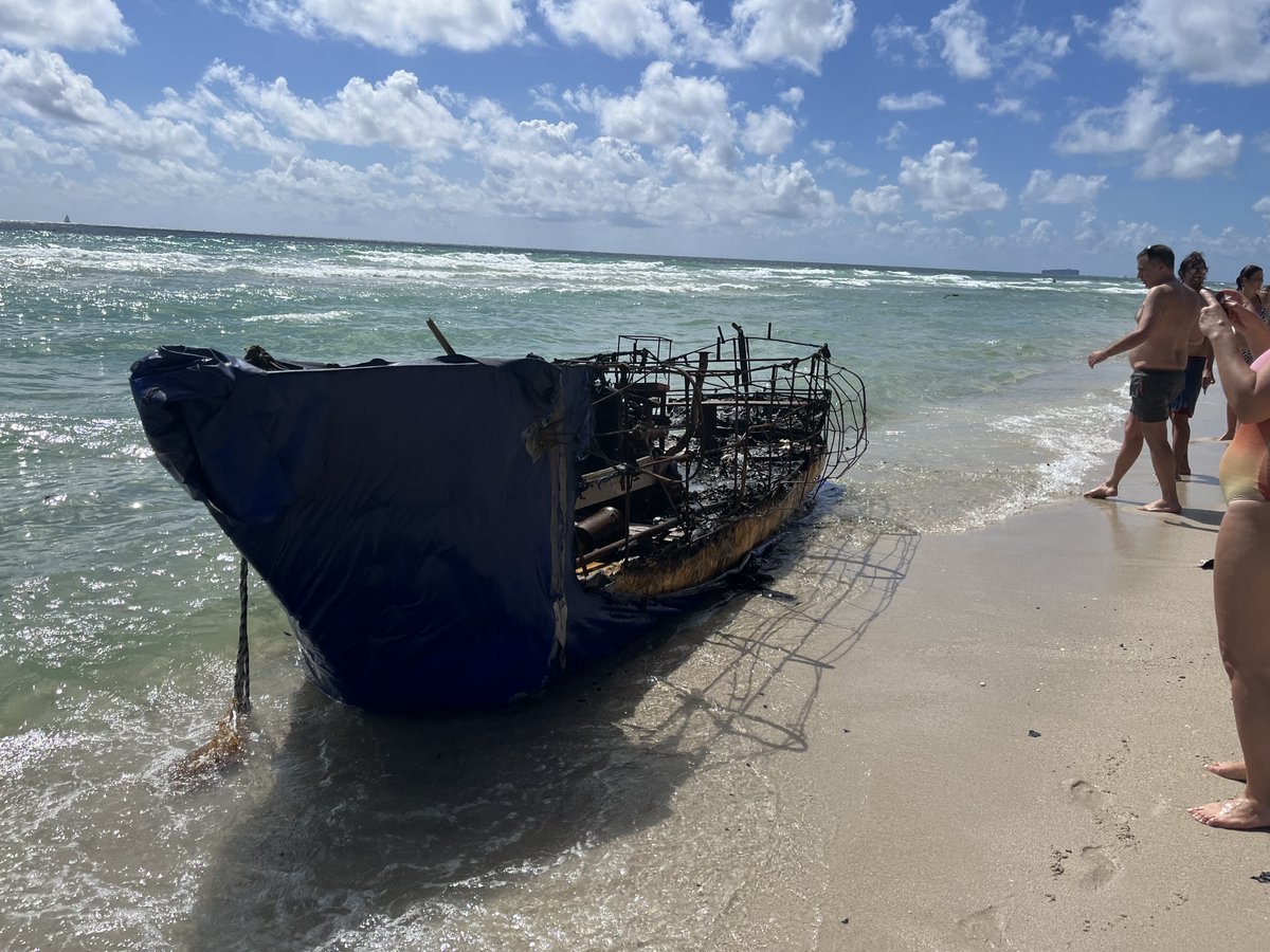 Mario_A_Loyola's tweet photo. This horrifying wreckage washed up on our beach in Surfside FL today, burned out, still smelling of gasoline and leaving a trail of ashes in the water. 100% Cuban refugees trying to make it to freedom. Almost certainly they died, prob overnight.   (1/5) https://t.co/S2wm8Q8Ybo