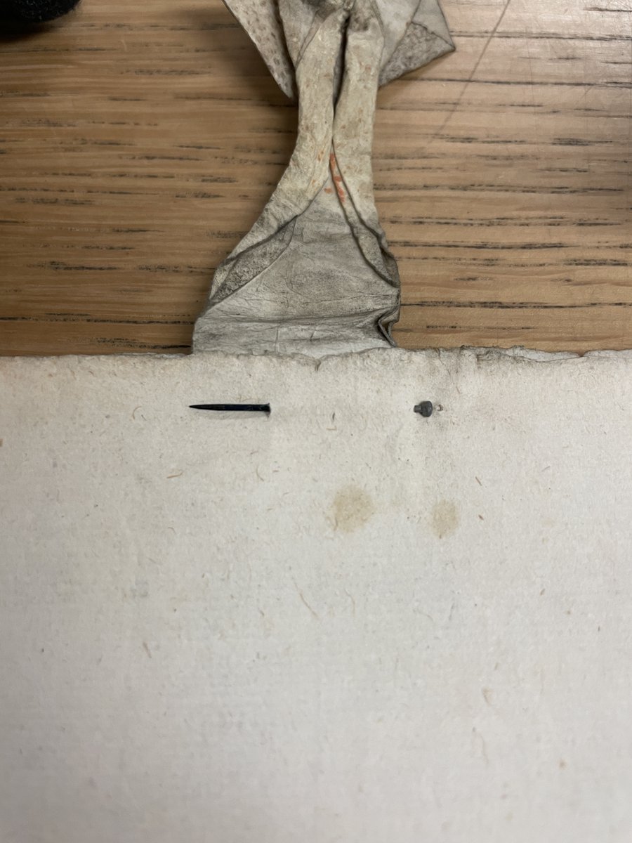 BookProbate's tweet photo. There are some material similarities in how wills were stored; even paper wills have vellum tags at times, and memoranda might be slipped between the folded pages. Other times, they used a pin to attach codicils and memoranda, like this! #MaterialCulture #BookHistory #Probate https://t.co/MzpEIbe582