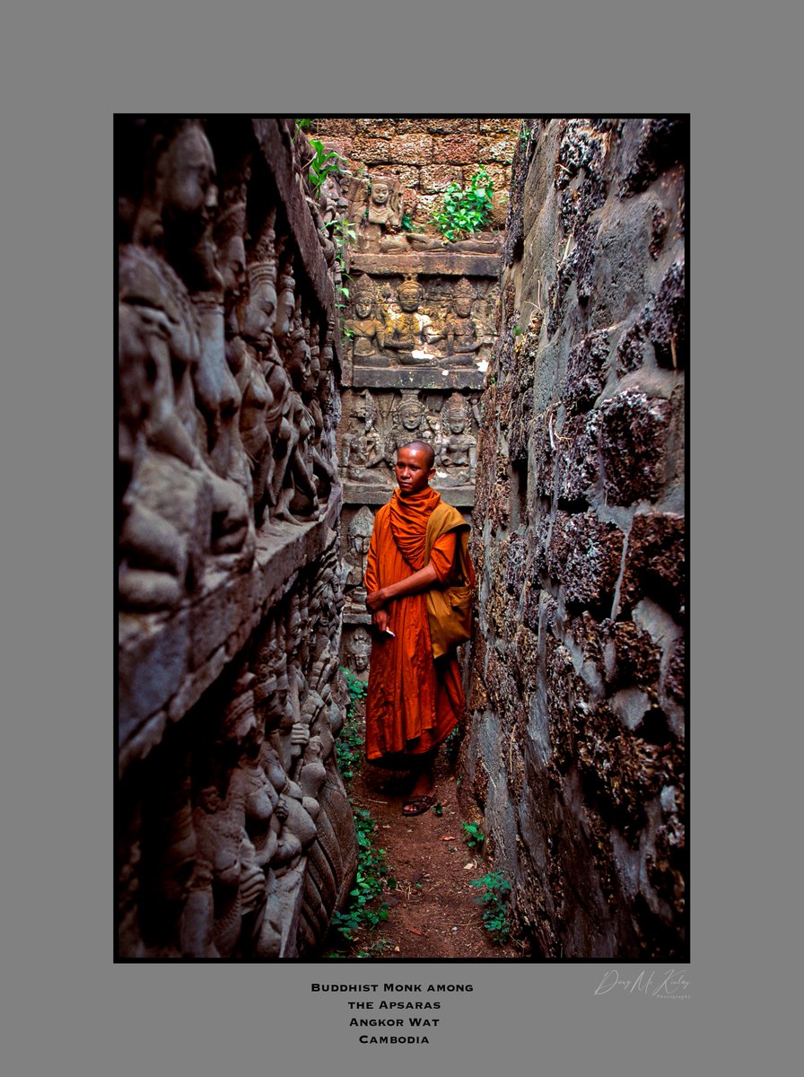 Going back a ways; Buddhist monk among the Apsaras of Angkor Wat in Cambodia, 1993...#buddhism #Cambodia #AngkorWat #documentaryphotography #UNTAC #apsara #monk #canonphotography #canon_photos #CanonF1n #colourphoto #reportage