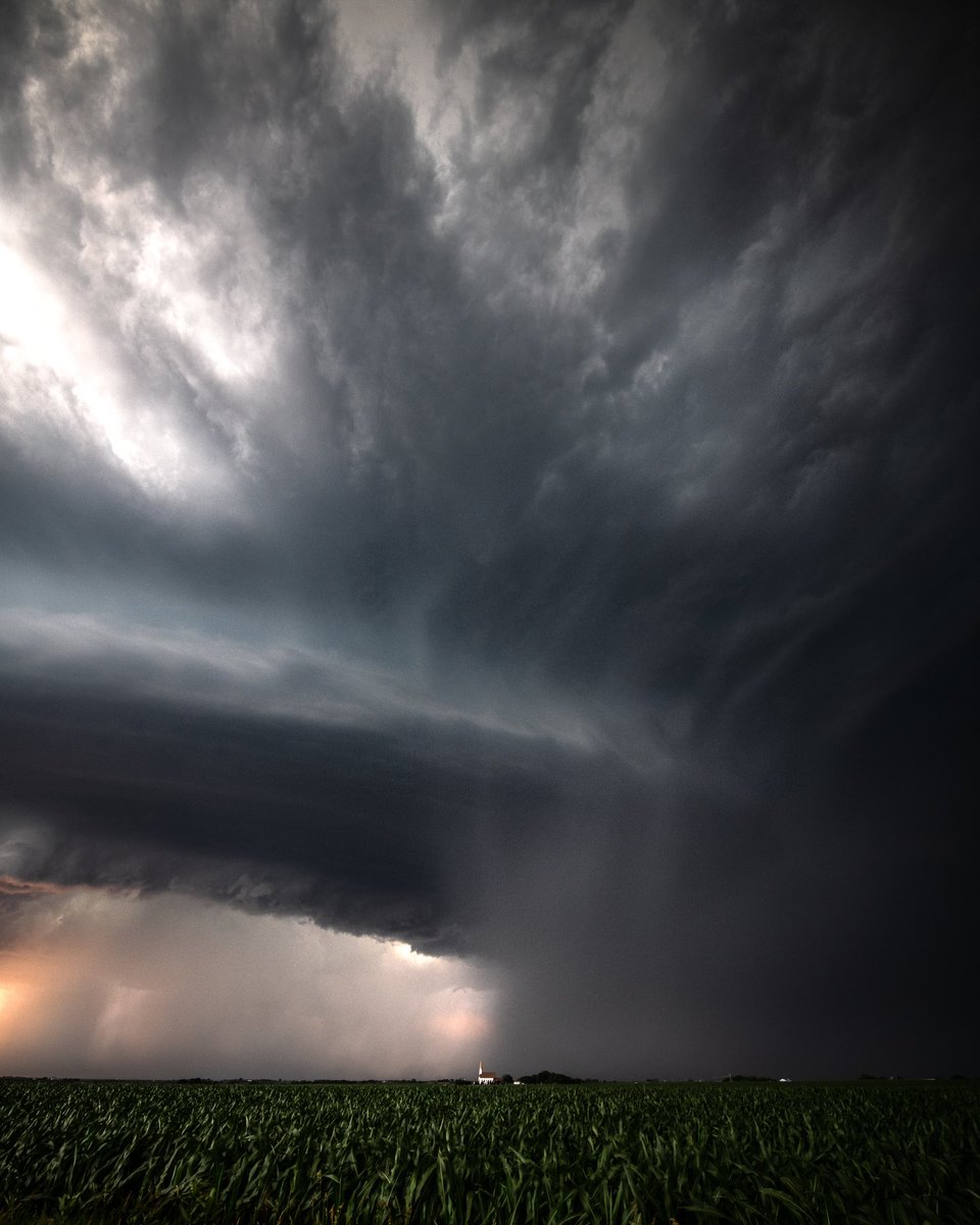 DreadlockTvlr's tweet photo. Doesn’t get much better then a corn field with a church in the distance as a supercell churns off in the distance. Love these Midwest views. ⛈ https://t.co/eGCYm55aBp