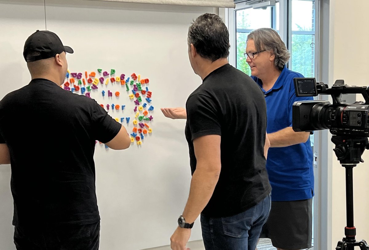 GembaAcademy's tweet photo. Our editing team is the best! We caught them having a bit of fun setting up a few shots to use as footage in upcoming content. #behindthescenes #gembaacademy #teamwork #continuousimprovement #lean #letterfactory https://t.co/p1AInw3g1I