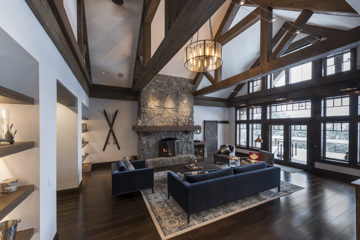 RoundtreeConst1's tweet photo. The Greatroom in this Adirondack classic has timber trusses flanking a large stone fireplace. This room has an expansive window wall with French doors leading out to the open deck area. 

Credits: 
Architect &amp; Photography: Holmes, King, Kallquist &amp; Associates Architecture https://t.co/121OJOyyzO