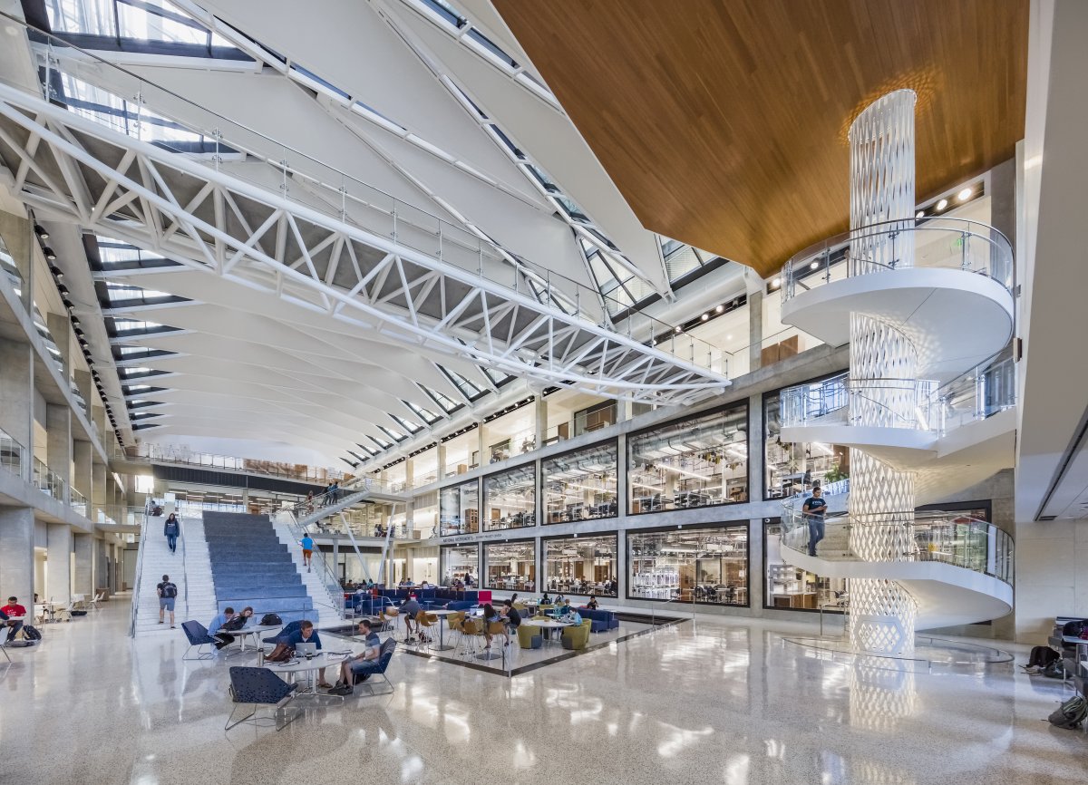 PivotalLighting's tweet photo. Skylights in the @UTAustin Engineering Education Center atrium provide a glimpse of the towers and interconnecting bridges above — where indirect #lighting illuminates adjacent ceilings and wood surfaces. #PivotalLightingDesign #PivotalLighting #lightingdesign #daylighting https://t.co/JVLPh1EPDz