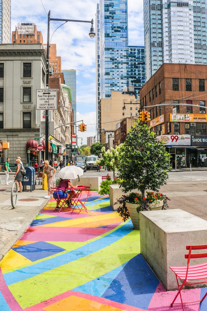 These new summer plantings go so well with the #streetart covering the neighborhood's #SharedStreets network! 🌳🎨 ​​​​​​​ 🌆 It's all part of our plan to transform DTBK's public realm so that it prioritizes people + the environment.​​​​​​​​ Learn more → bit.ly/DTBKPublicRealm