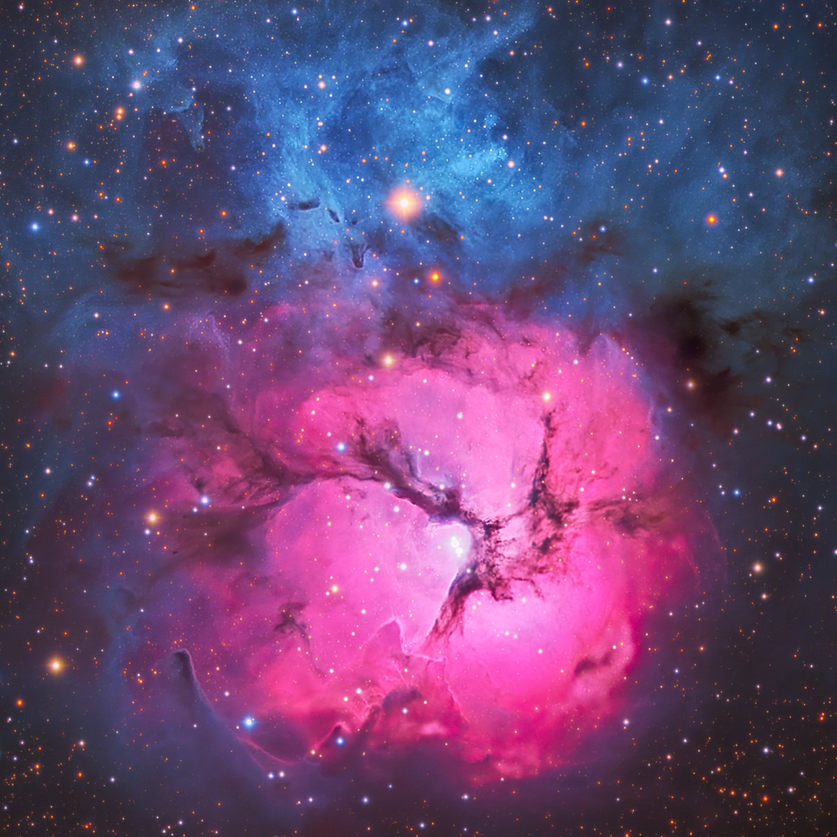My photo of the Trifid Nebula, a small nebula located 4,000 light years away. 

While technical details are cool and all, I think it looks like forbidden cotton candy and I really haven't gotten past that.