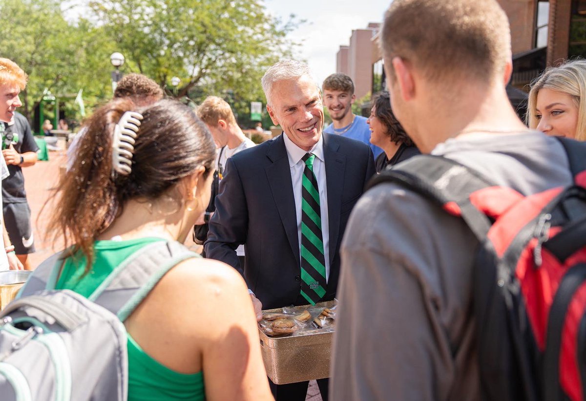 marshallu's tweet photo. Our @marshallupres handed out cookies today to welcome students to campus for the start of the fall semester!  
#BackToMarshallU #MarshallUFamily #MarshallUStudents https://t.co/QoKyg821ak