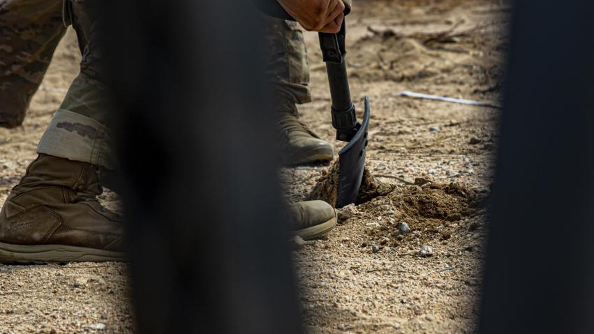 ArmyGeospatial's tweet photo. #SandTables @FightingFirst Soldier digs a root out of the ground before building a sand table at Fort Irwin. Attention to detail! https://t.co/cMcIDaQgcw