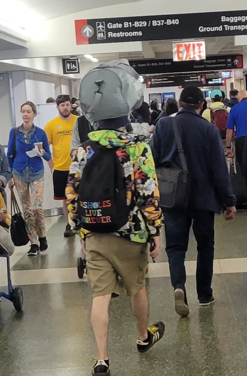 pdaveb's tweet photo. Definition of #DoinTooMuch
"Assholes Live Forever" backpack, Rugrats jacket, and as soon as we got off the plane he decided best way to carry his bag was National Geographics stlye through the airport.
Oh! Also had an "Assholes Live Forever" mask😷.
#WhyAreYouThisWay https://t.co/HIaIGix9hz