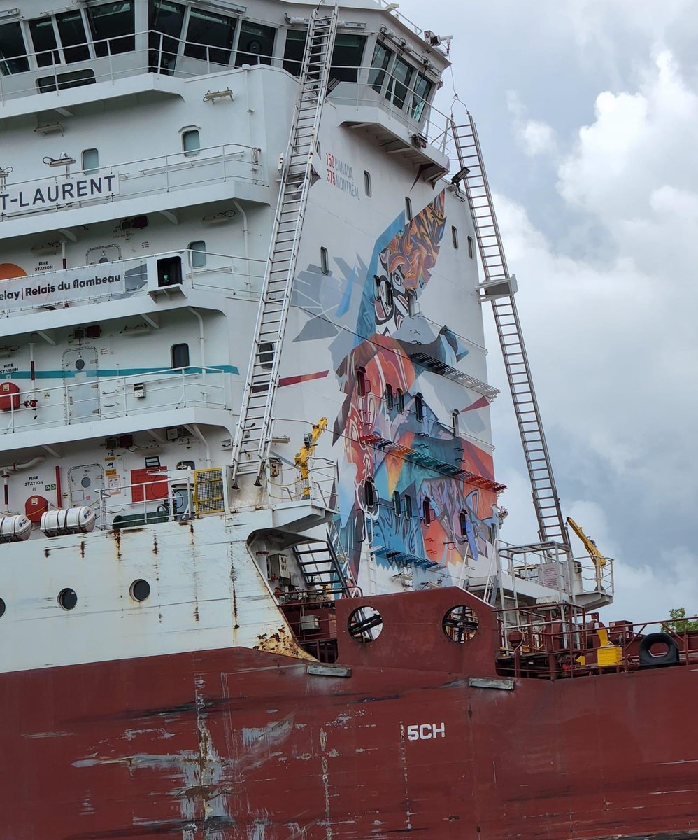HopefulWaysOrg's tweet photo. Super-sized ships w/interesting artwork. Not a good angle, but good vision lets you appreciate it. Improving vision is what @HopefulWaysOrg is doing for the poor. Today's ride went N to Lake Ontario @ Sunset Beach, Port Weller Beach, Port Dalhousie &amp; back. The rain did not deter. https://t.co/XX5taEmXQU
