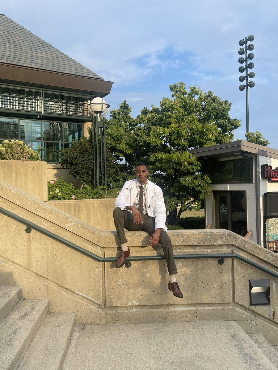 __ahmedx26's tweet photo. In honor of officially being coated and forever being remembered by my classmates as “the guy that wore a Gucci belt to our ceremony”🫡🥼🤣 to 4 more years of being a student and a lifetime after that!🥳👨🏾‍⚕️ #BlackMed2026 #MedTwitter https://t.co/VXO60OkEgG